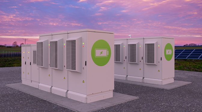 A photograph of an outdoor battery energy storage system near a photovoltaic farm in Poland